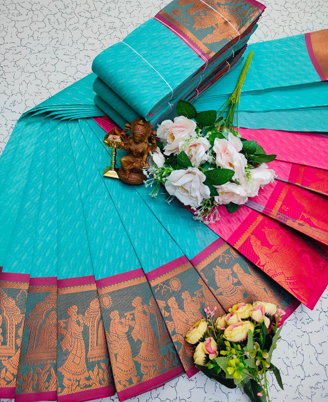 Aqua green saree with magenta zari border