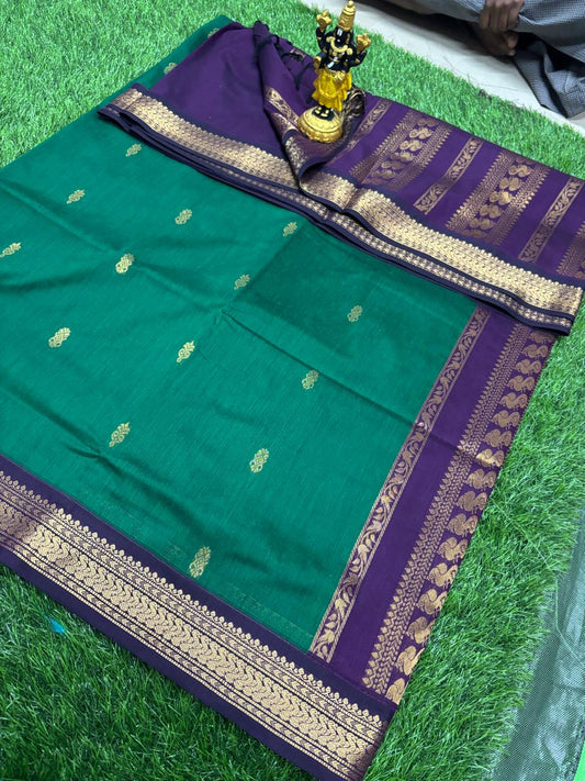 Emerald green saree with purple gold zari border and woven motifs
