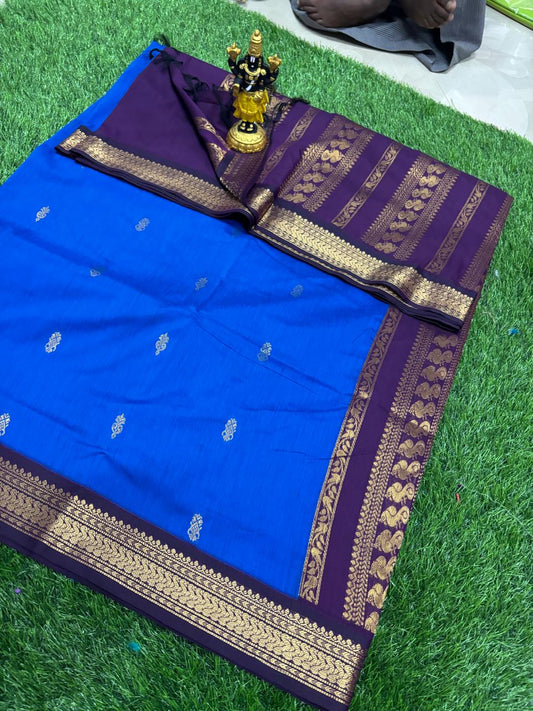 Bright blue saree with purple gold zari border and woven motifs