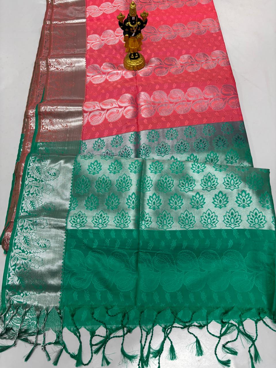 Coral pink Elampillai silk cotton saree with emerald green border and silver zari work