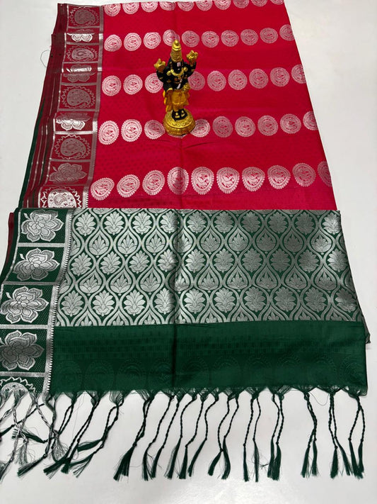 Deep red Elampillai silk cotton saree with dark green border and silver zari motifs