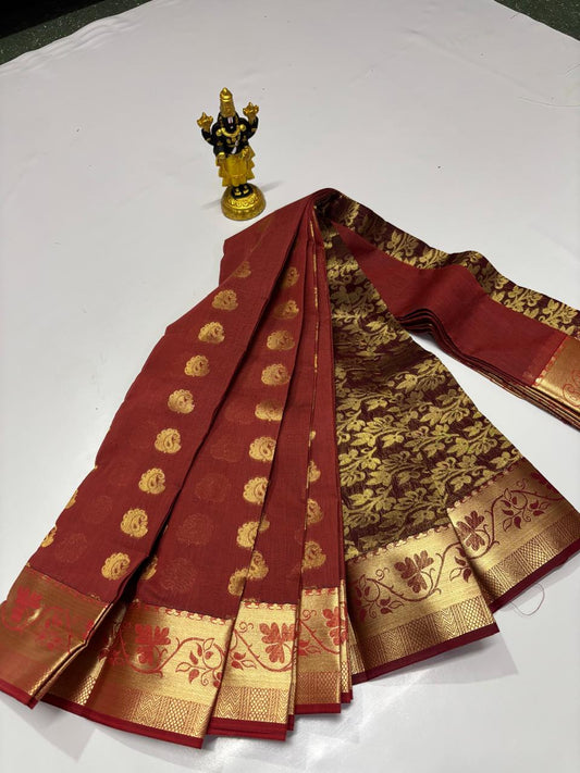 Brick red Elampillai silk cotton saree with gold zari motifs and traditional border
