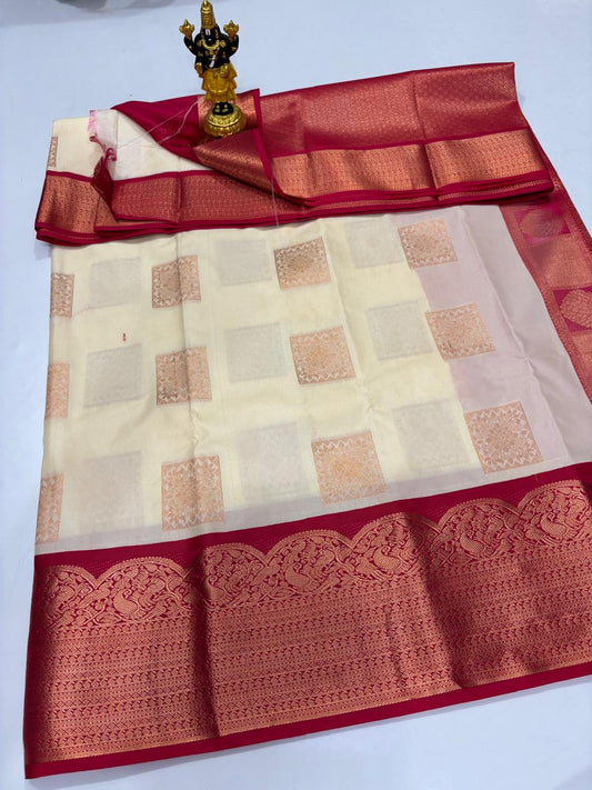 Cream Elampillai silk saree with maroon border featuring peacock zari designs.
