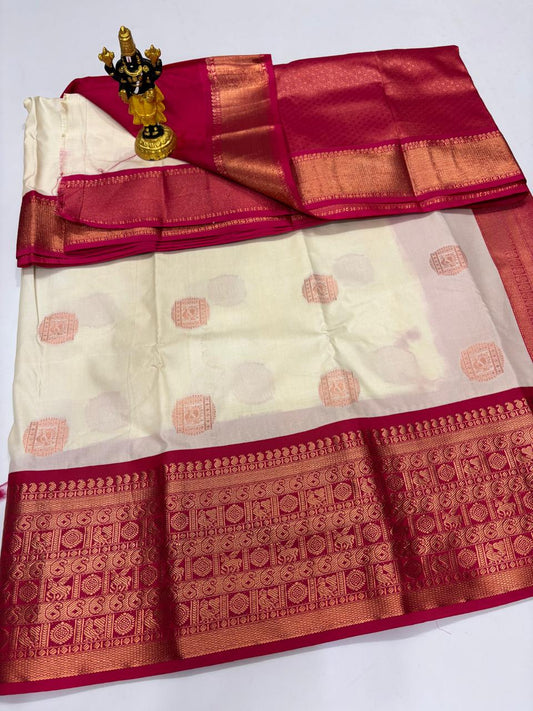Cream Elampillai silk saree with maroon border featuring heavy traditional zari motifs.