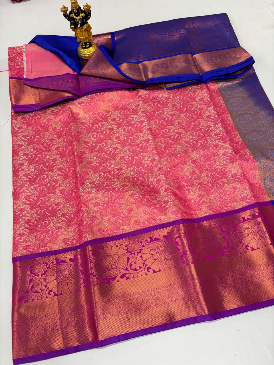 Blush pink saree with silver patterns and royal blue border