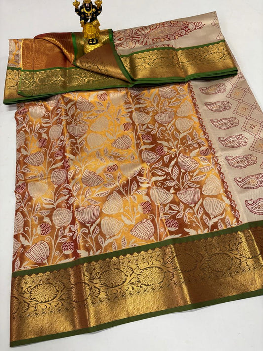 Cream silk saree with floral vines and green gold border