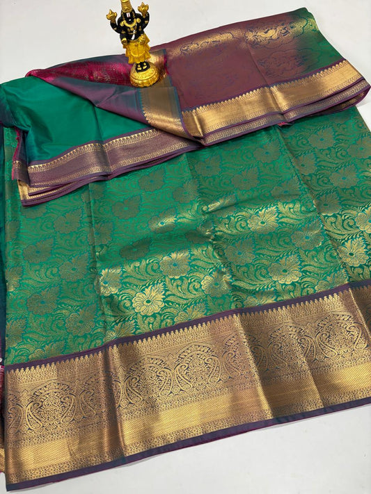 Emerald green silk saree with heavy gold floral jaal