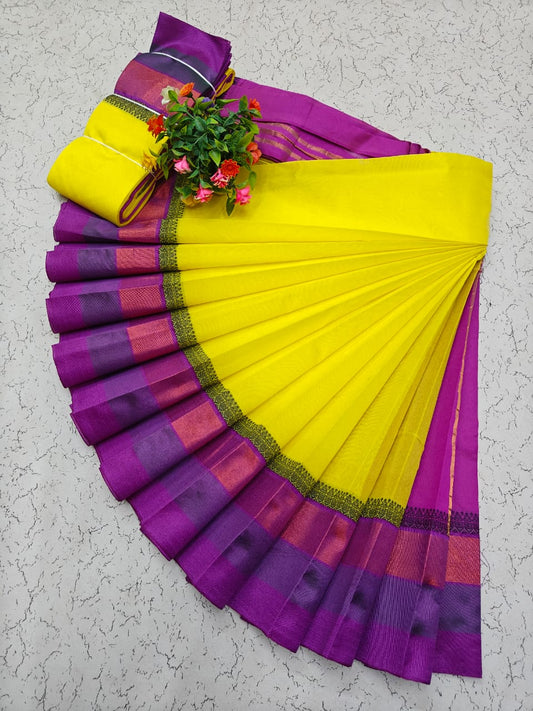 Bright yellow Elampillai saree with purple zari border.