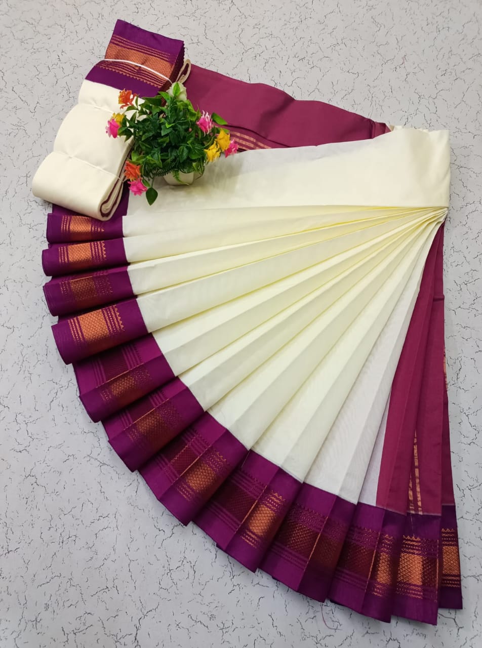 Cream Elampillai saree with wine purple zari border and temple motifs.