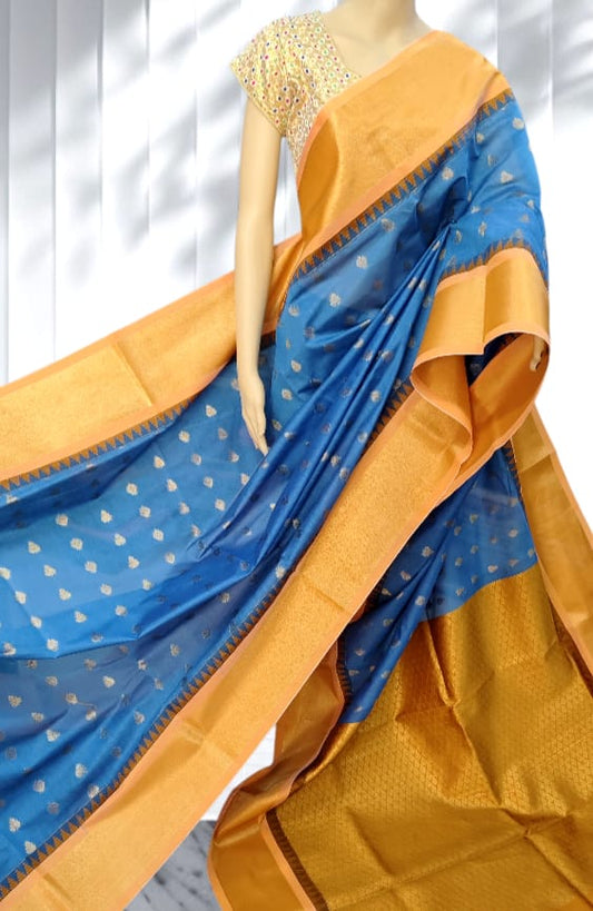 Cerulean Blue Elampillai saree with mustard gold zari border and paisley motifs.