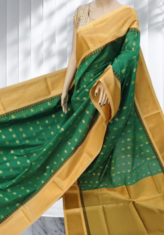 Emerald Green Elampillai saree with mustard gold zari border and paisley motifs.