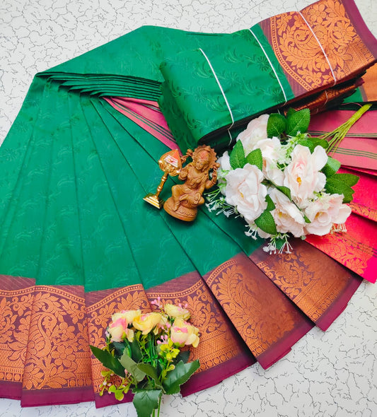 Dark green saree with maroon zari border and woven design